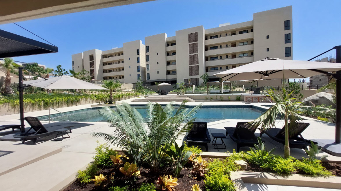 Clubhouse view over saltwater pool and heated Jacuzzi